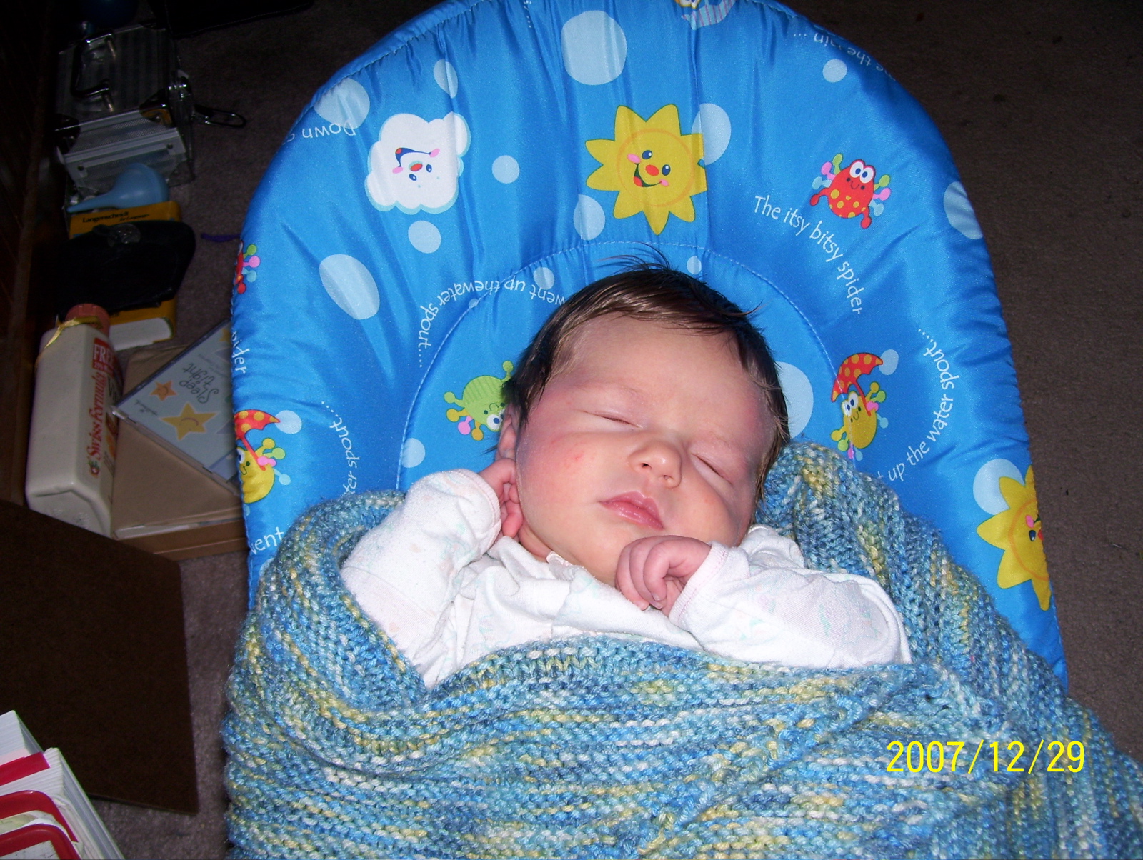 snoozing in bouncy chair