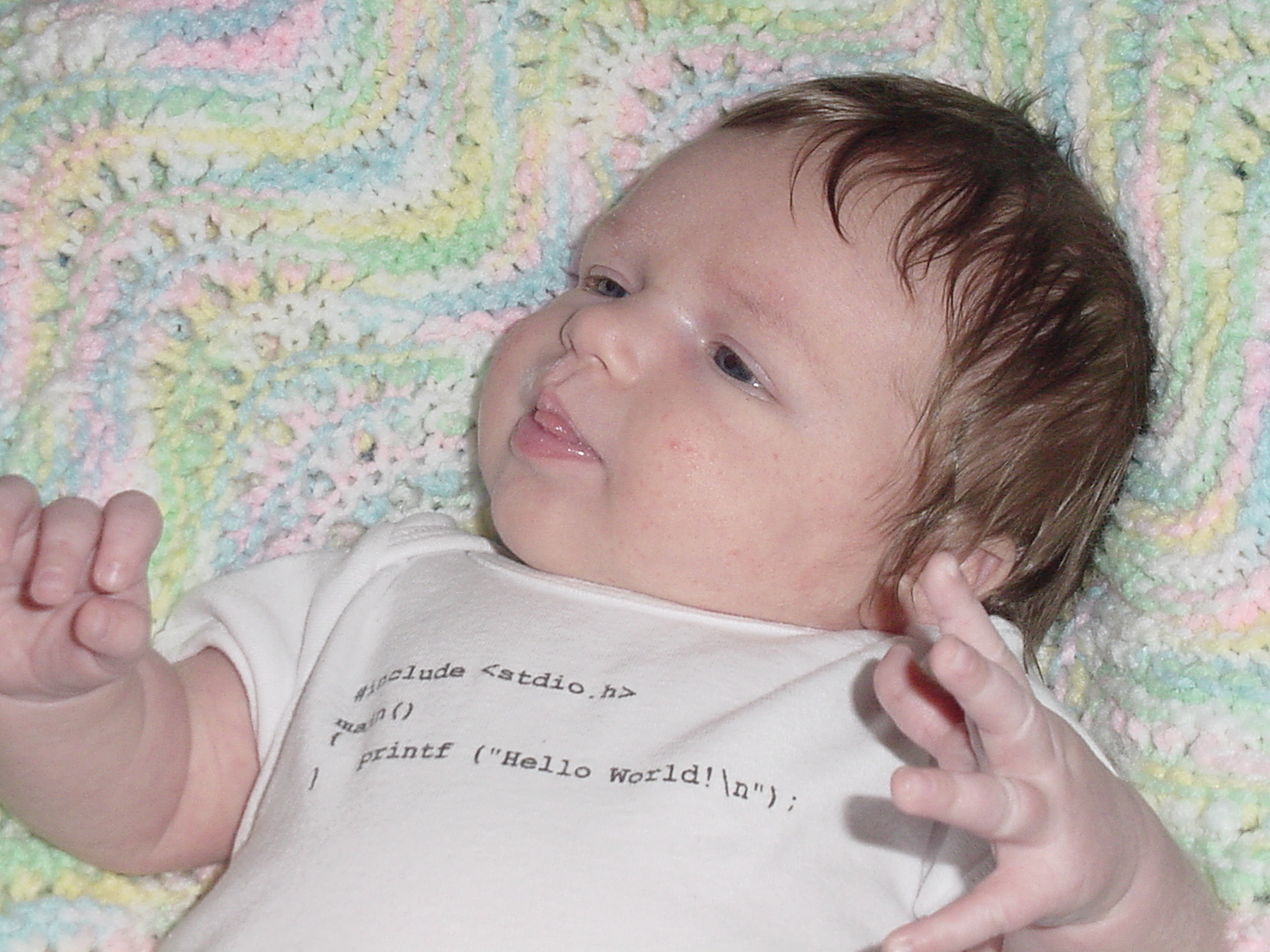 Wearing "Hello World" onesie