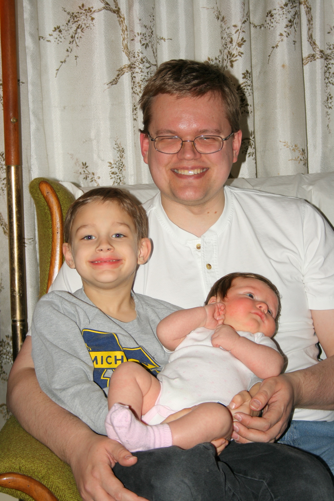 Cousin Justin holds KatieBeth.